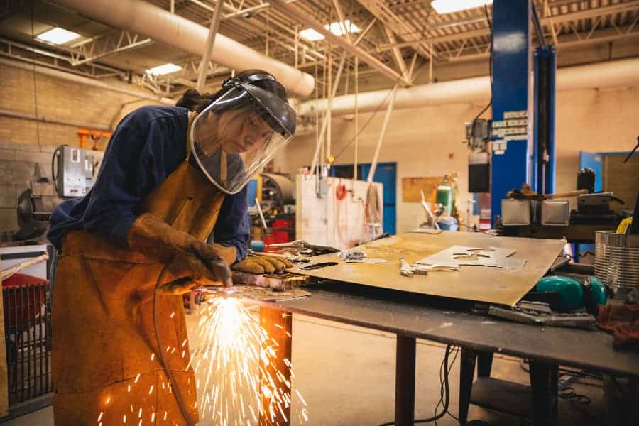 Student practicing welding skills at trade school