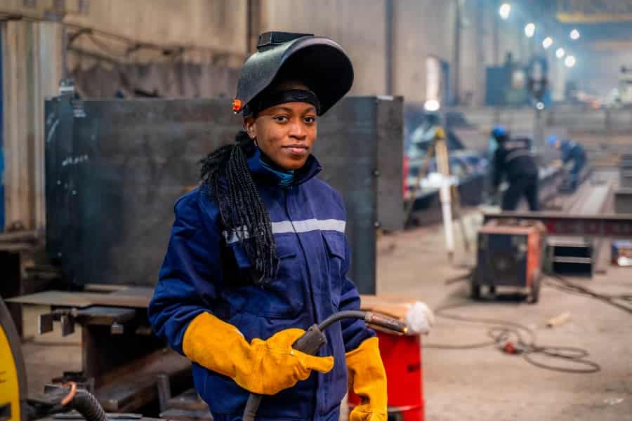 A young student practicing welding skills